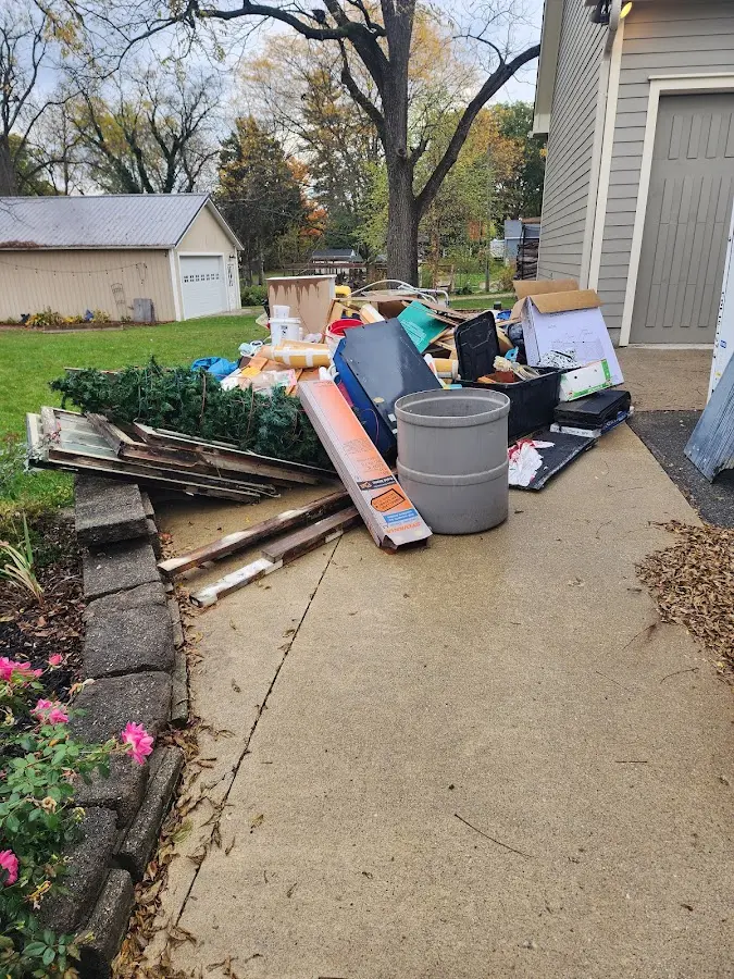 Dumpster being loaded with debris for 3 Yard Dumpster Rental in Oak Forest